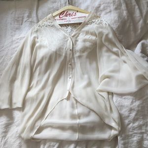 A Cynthia Vincent cream tunic. Never been worn.