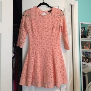 A salmon, lace, fit-and-flare dress
