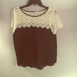 Black shirt with white lace on top
