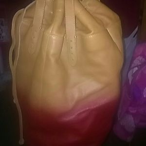Very unique red and tannish large purse.