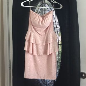 Light pink peplum strapless dress.