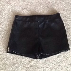 Faux leather shorts with zippers on sides