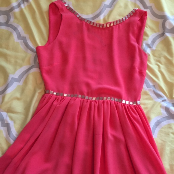 Super cute bright pink dress with detailing.