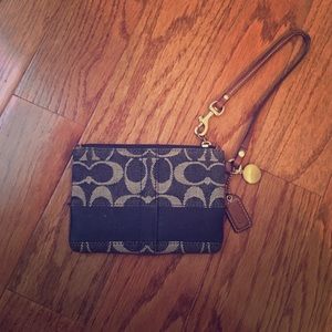 Coach denim inspired wristlet. Good used condition