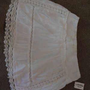Short white skirt from Tillys. Size M in girls.