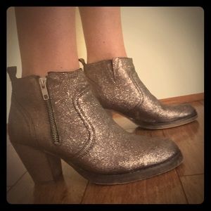 Blackish gold booties with a 2 3/4 inch heel