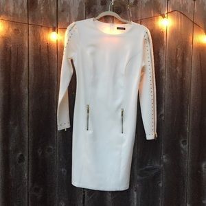 White dress with gold zippers