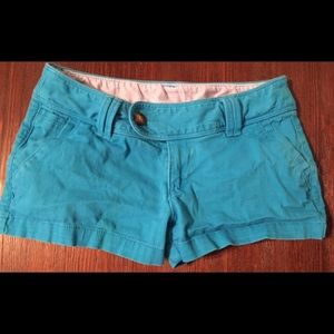 Red camel blue shorts
