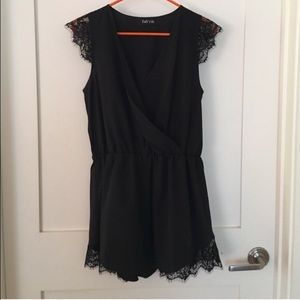 NWOT!  Black romper with lace detail.