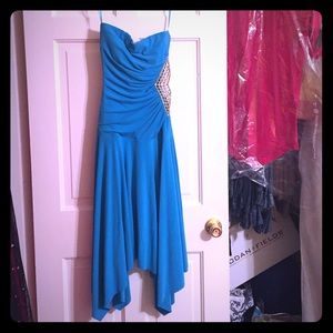 Teal formal dress with rhinestone side cut out.