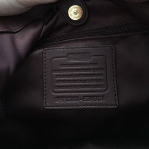 Plum coach purse