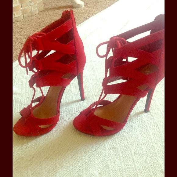Red strappy heels.