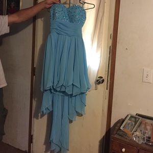Blue strapless high to low prom dress.