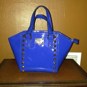 Faux patent leather satchel. New without tags.