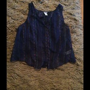 A blue silk shirt with colorful details