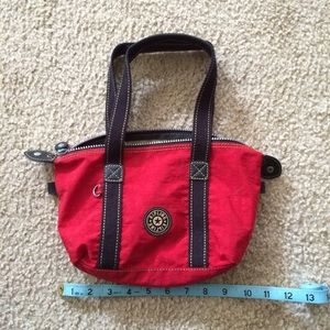 Good used condition red Kipling bag