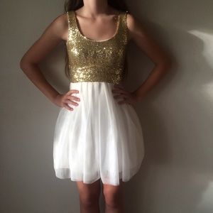 B. Darlin gold sequin and white dress with bow