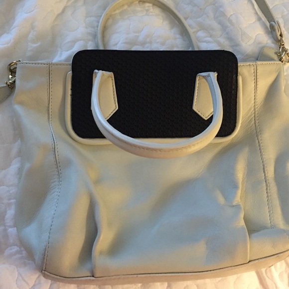 Cross body white purse with black accent