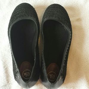 The Sak black woven flats