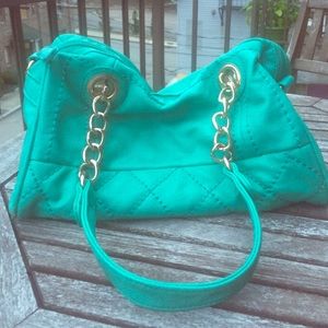 Teal quilted bag.