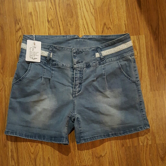 NWT high waisted denim shorts with crochet trim.