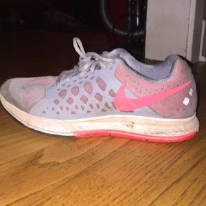 Grey and pink Nike running shoes