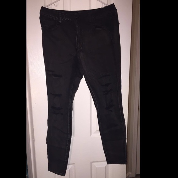 Woman's black ripped American eagle jeans