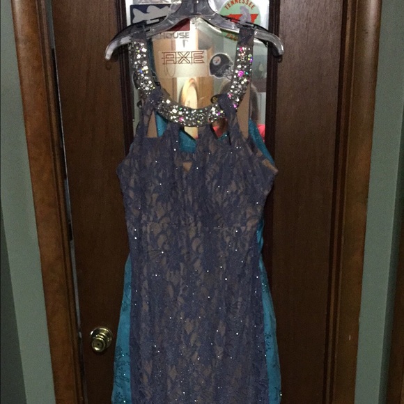 Floor length dusty blue prom dress.