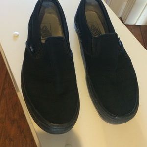 All black slip on vans