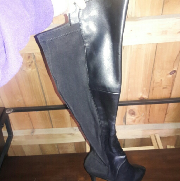 Black leather over knee high heal boots