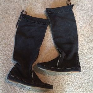Tall brown moccasin boots