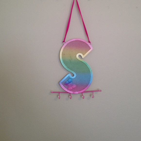 A colorful necklace holder/letter s