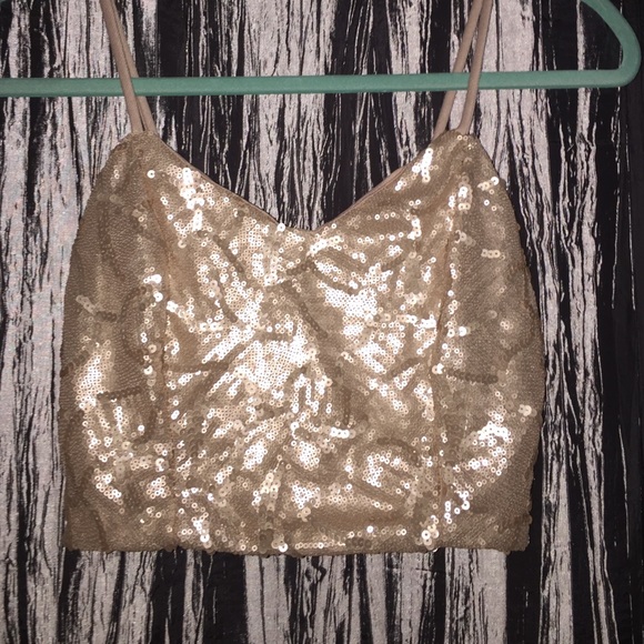 Gold sequined crop top.