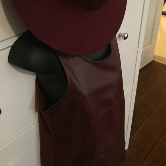 Faux leather front, see thru in back w/gold zipper