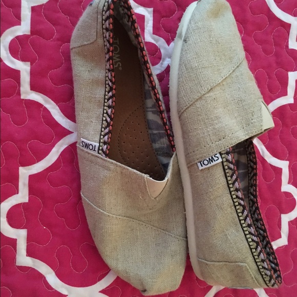 Cream colored womens Toms shoes