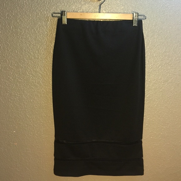 Black pencil skirt with mesh trim detail.