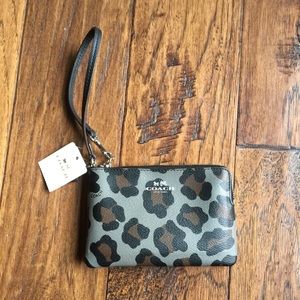 Comes with tags/Never Used. Coach Cheetah Wristlet