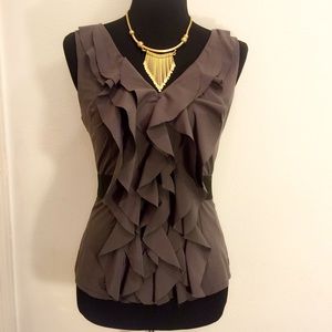 Fitted grey ruffled sleeveless blouse