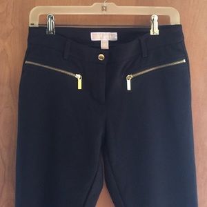 Michael Kors black keg gongs with gold zippers.