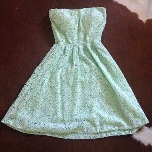 Mint lace strapless dress.