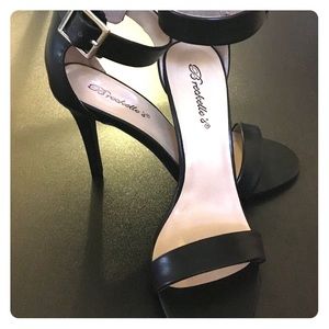 Simple black ankle strap heel.