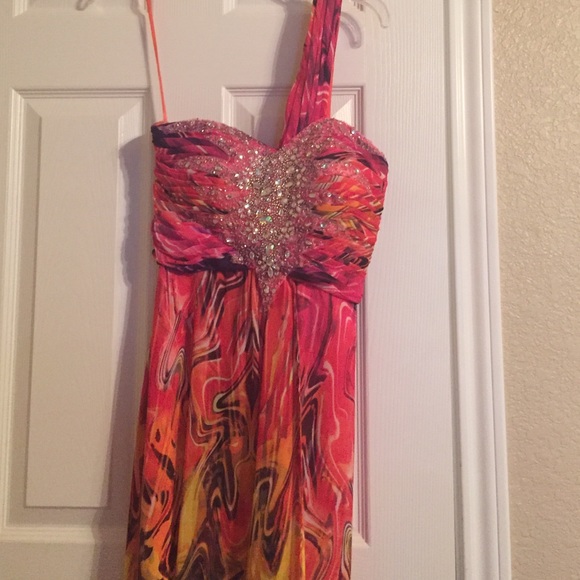 Long flowing one shoulder strap gown.