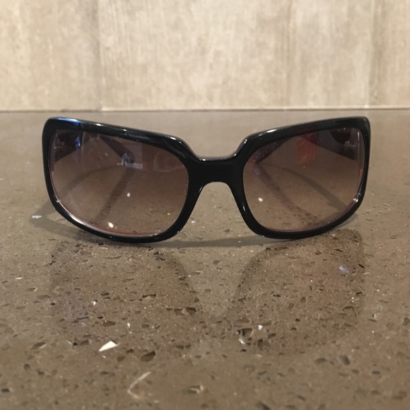 Black Coach sunglasses with dark pink inside