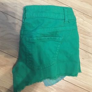 green Jean shorts