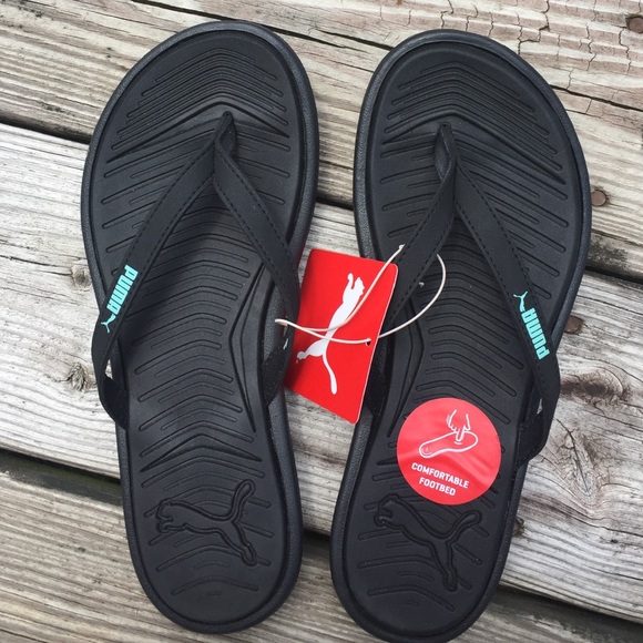 Black PUMA Lux flip flops