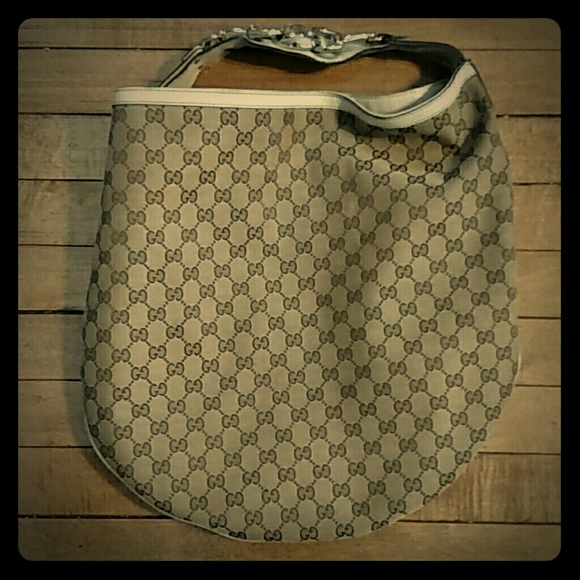 Gucci canvas hobo bag with gold metal hardware