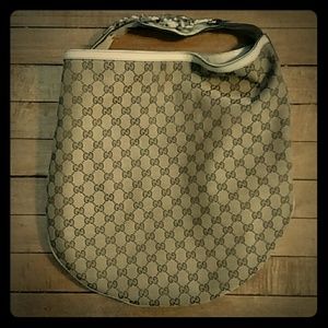 Gucci canvas hobo bag with gold metal hardware