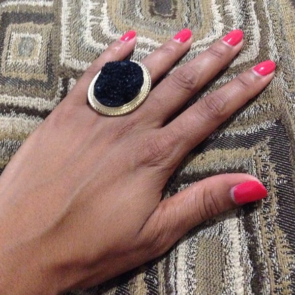 Gold ring with black rock