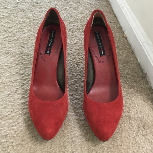Red suede pumps
