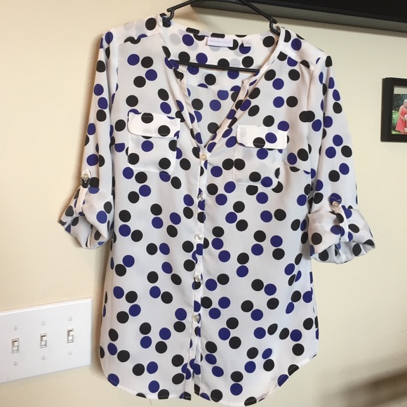 White blouse with black and blue dots